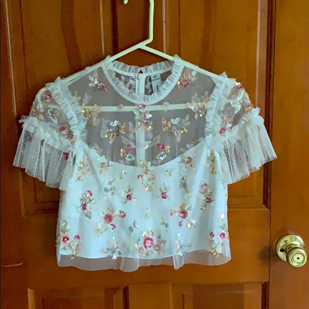 Embellished top with flutter sleeve in ivory